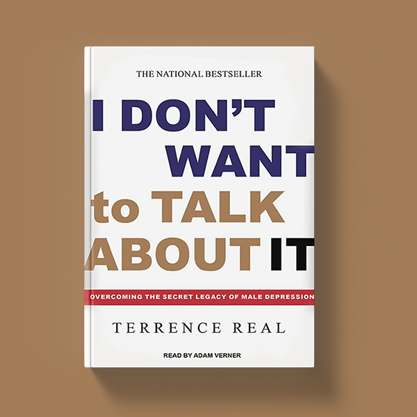 A demonstration of the physical book I Don't Want to Talk About It by Terry Real with a white cover and large typography taking up all the space