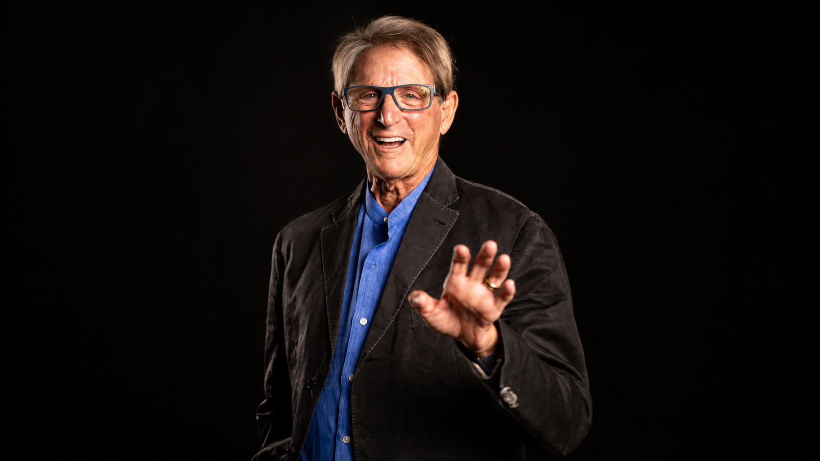 Terry Real presenting Relational Life Therapy in a wide studio portrait.